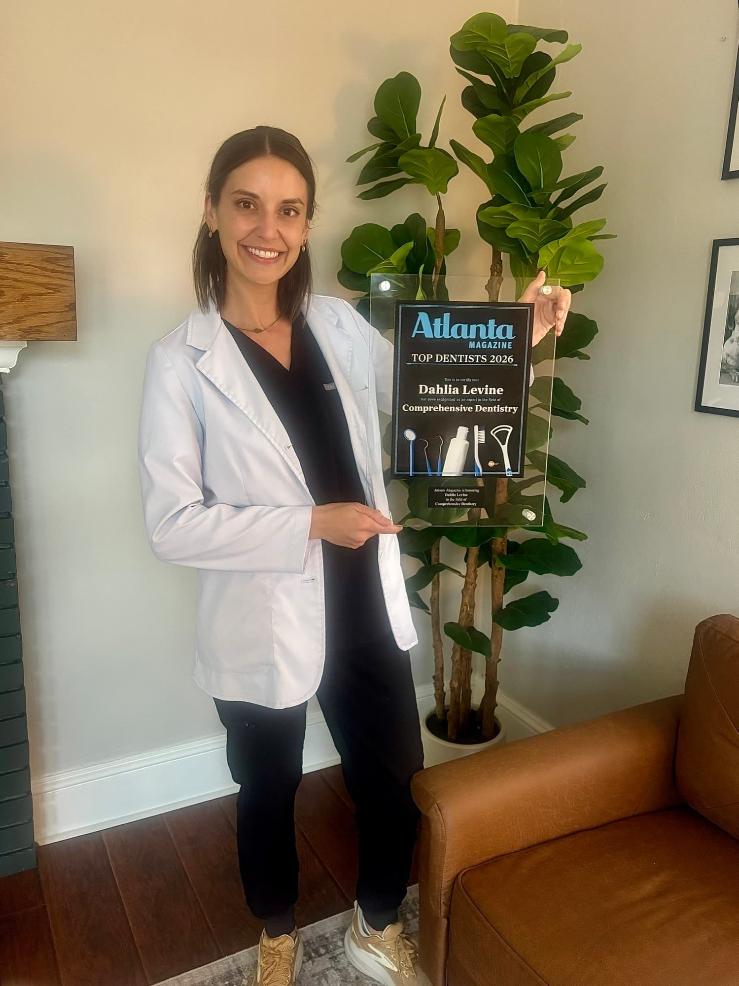 Dr. Levine holding her Atlanta Magazine Top Dentists 2026 award