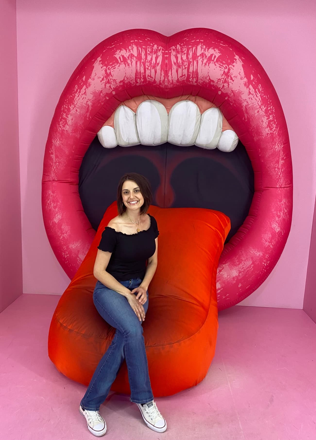 Dr. Levine having fun on a giant mouth art installation